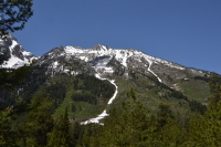 a glacier winding down the mountain