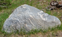 another stone with undulating stripes